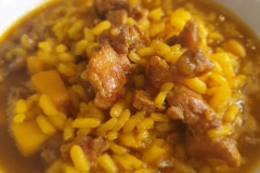 Arroz con calamar y pichón